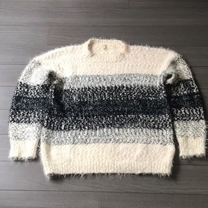 Black and cream oversized eyelash sweater